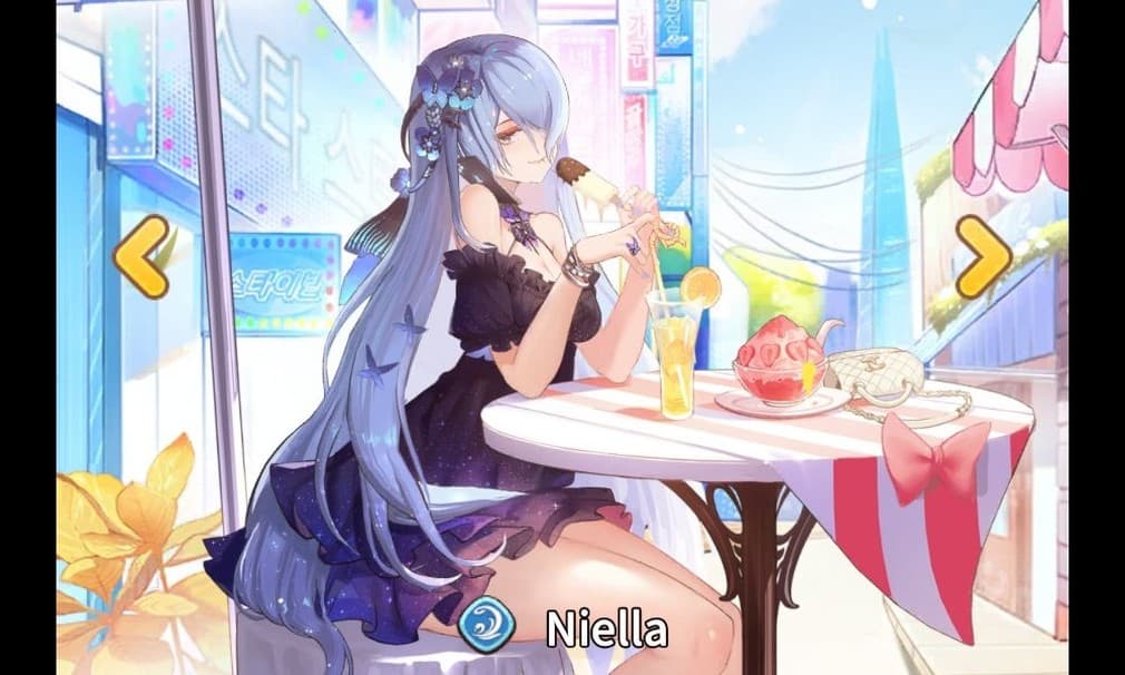 Niella sitting at the table eating icecream and drinking lemonade