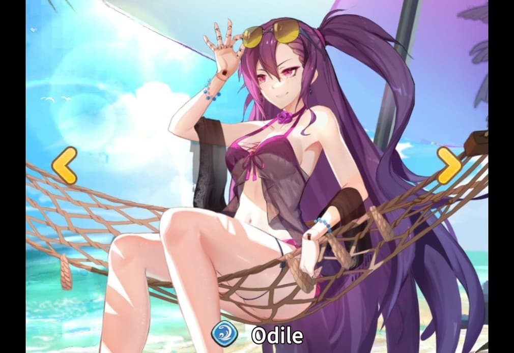 Odile sitting in a rope hammock with beach behind her