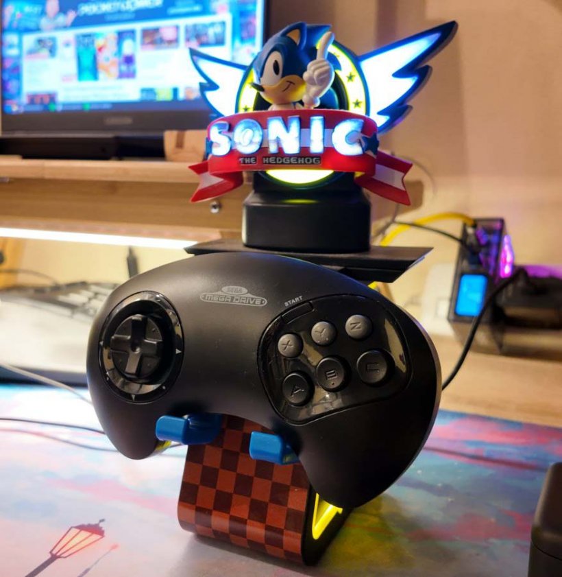 retro-bit sega mega drive controller on a sonic the hedgehog stand